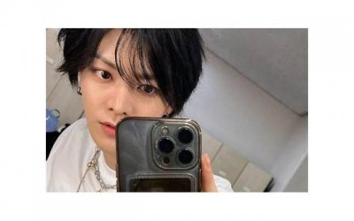 ​高圆圆发型，高圆圆穿橘红色毛衣留短发妩媚动人